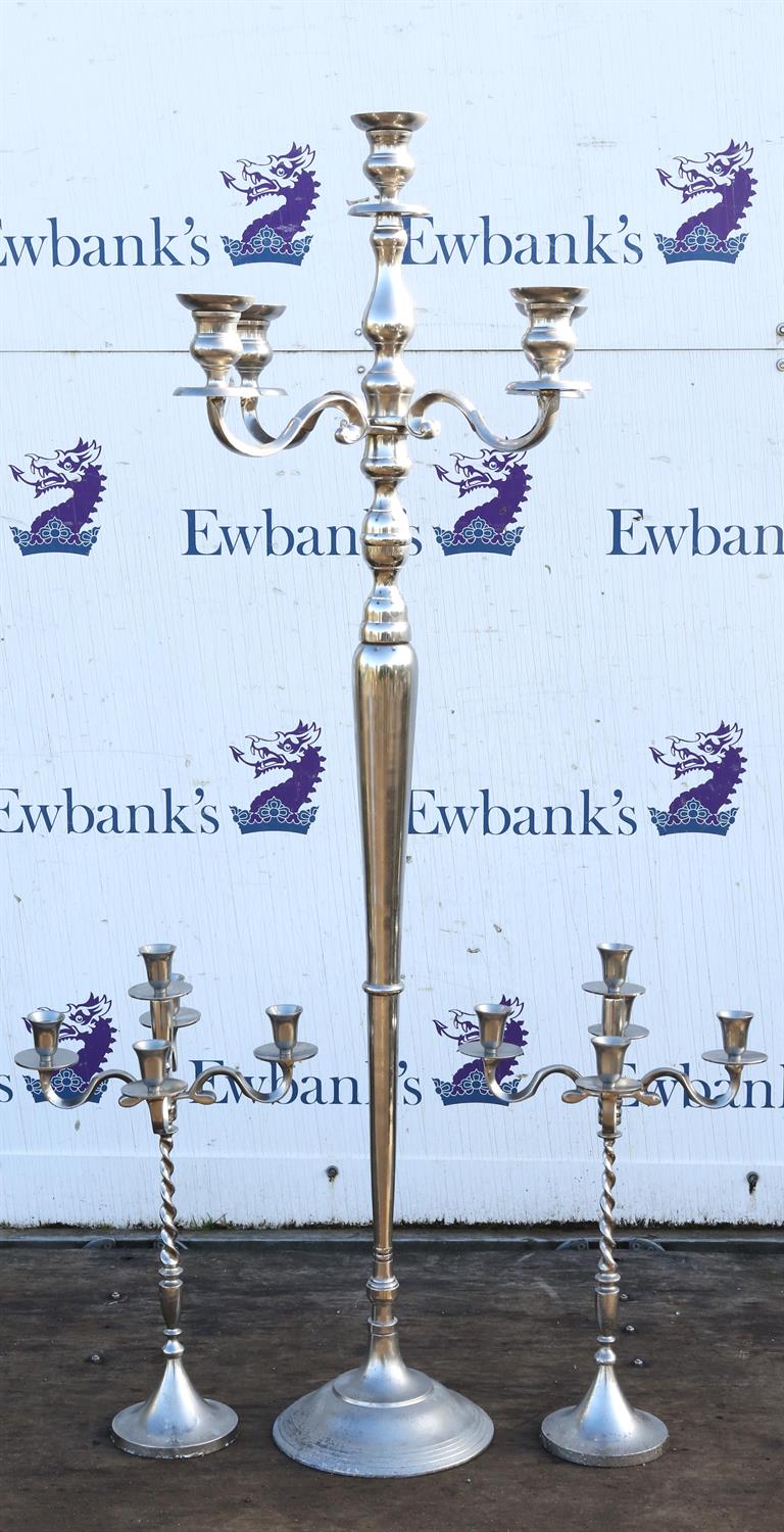 A modern tall silver metal five light candelabra, 155cm high. and a pair of smaller similar