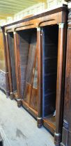 A late 19th century French mahogany cupboard book case, the four sections with central cupboard