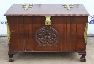 A Modern mahogany and brass bound blanket box raised on large pad feet.