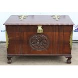 A Modern mahogany and brass bound blanket box raised on large pad feet.