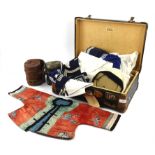 A small German suitcase by Vogel, containing a child's Chinese silk jacket, silk splitting,