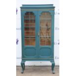 A George III style blue painted and gilt bookcase, 1910/20s, in the Chinese taste, on cabriole legs,