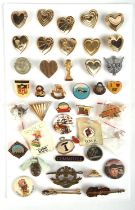 A collection of various badges, pins and brooches including BBC, Mickey Mouse, sports and band pins.