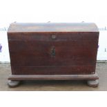 A 19th century dome topped oak chest with iron handles. 112 cm wide x 58 cm deep x 83 cm high.