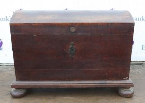 A 19th century dome topped oak chest with iron handles. 112 cm wide x 58 cm deep x 83 cm high.