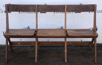 Set of oak folding theatre seats, for three people, late 19th /early 20th Century,