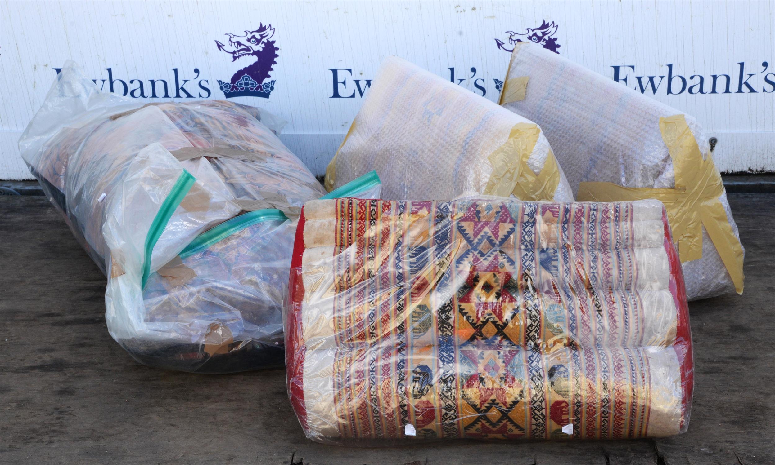 Three triangular bolster cushions, Thailand, striped and with geometric motifs, one with elephants,