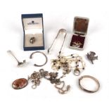 A selection of silver jewellery and items, including a silver spoon, a pair of sugar tongs