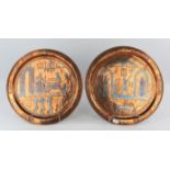 Two Egyptian copper and white metal souvenir plates, depicting scenes of a pharaoh riding a chariot