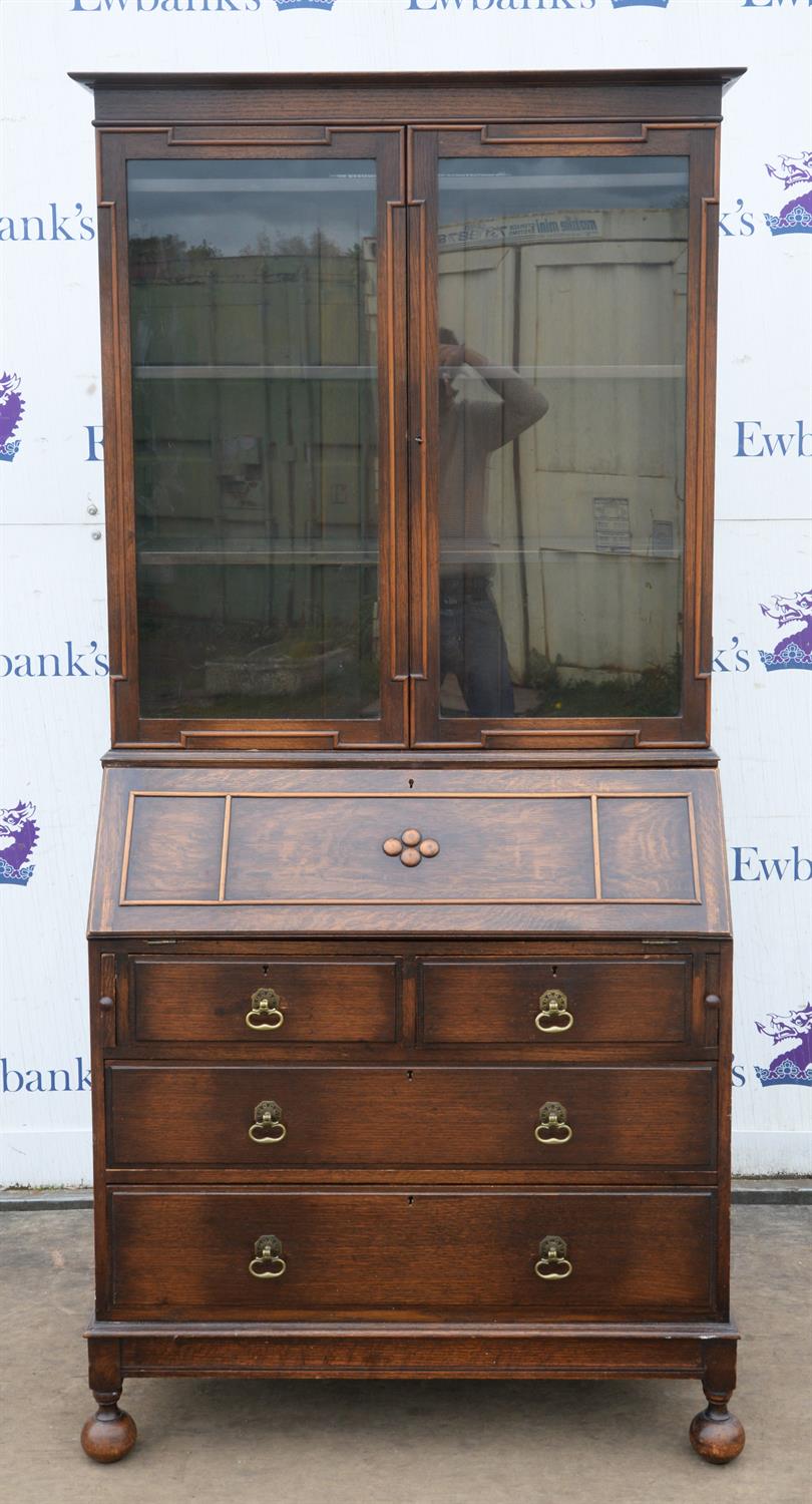 A William and Mary style oak bureau bookcase, 1910/1920s, in two parts, with upper glazed doors