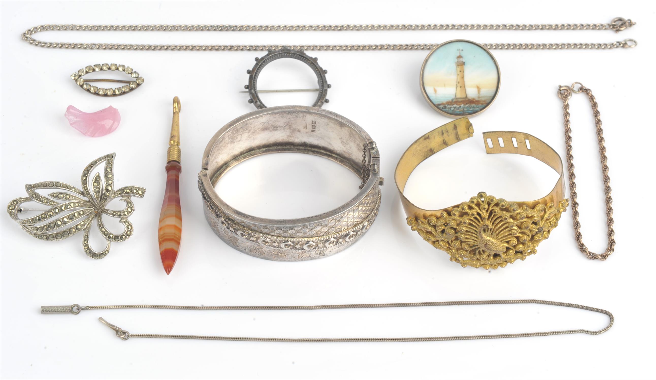 A group of antique and vintage items including a Victorian silver bangle, with crescent moon and
