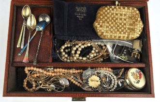 A leather jewellery box containing costume jewellery, including silver brooches, chains,