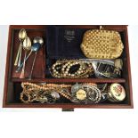 A leather jewellery box containing costume jewellery, including silver brooches, chains,