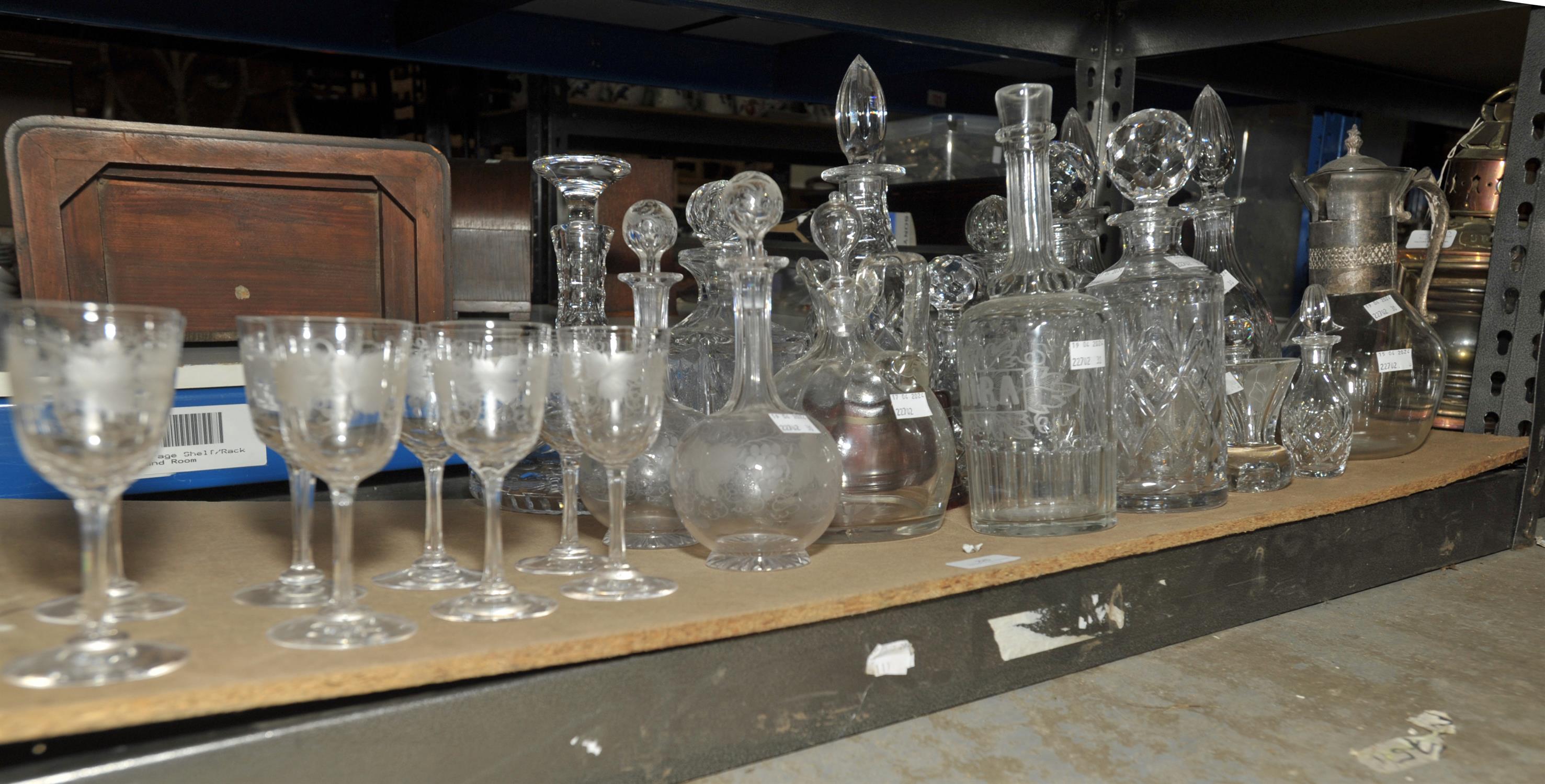 A pair of late 19th century globe and shaft decanters and eight matching wine glasses,