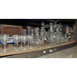 A pair of late 19th century globe and shaft decanters and eight matching wine glasses,