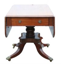 A George IV mahogany pedestal pembroke table, 1820s, the sold top above two drawers,