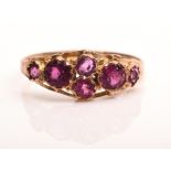Antique cluster ring set with six round cut paste stones with an engraved shank in 9 ct, size N