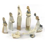 A group of 7 Lladro and Nao figures, 5 boxed.