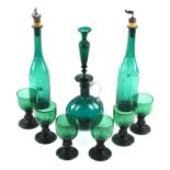 Pair of Victorian green glass decanters, with associated cork and silver plated stoppers, 31.