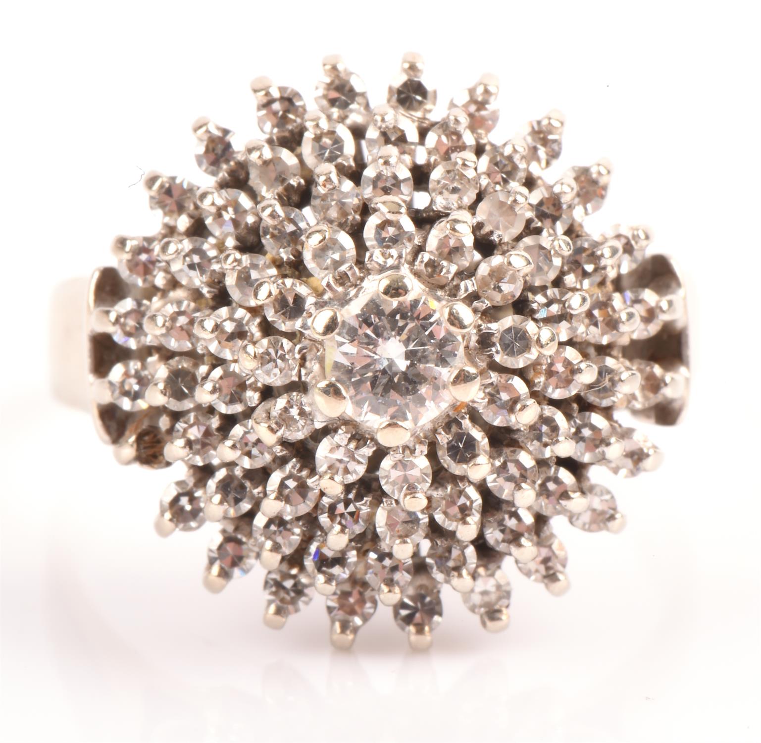 Diamond cluster ring, central round brilliant cut diamond weighing an estimated 0.20 carat,
