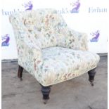 Victorian armchair, upholstered in floral material with button back design, 73cm high