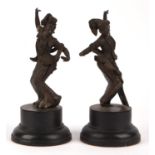 A pair of Balinese [or other South East Asian] bronze dancers; each one on a circular base; overall