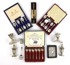 Three sets of cased tea spoons, silver mounted organiser, pair of sterling silver dwarf