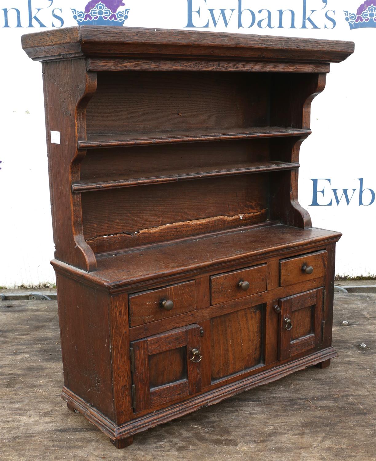 Miniature oak dresser, possibly late 19th/early 20th Century, with pot rack above cupboards and