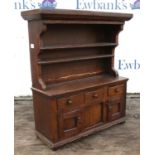 Miniature oak dresser, possibly late 19th/early 20th Century, with pot rack above cupboards and