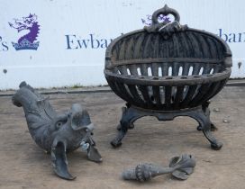 A Victorian cast iron fire basket, of oval openwork form, on cabriole legs, together with a cast