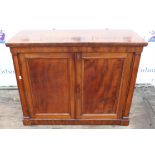 Mahogany cupboard, 19th Century, with two panelled doors enclosing a shelf, on plinth bae,