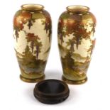 Pair of Satsuma vases, early 20th Century, decorated with continuous landscapes of buildings and