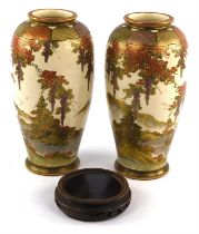 Pair of Satsuma vases, early 20th Century, decorated with continuous landscapes of buildings and