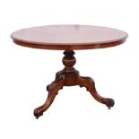 Victorian walnut breakfast table, circular top on a baluster stem with leaf carved cabriole legs,