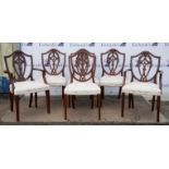 A set of six George III style mahogany dining chairs, of shield back Hepplewhite form,