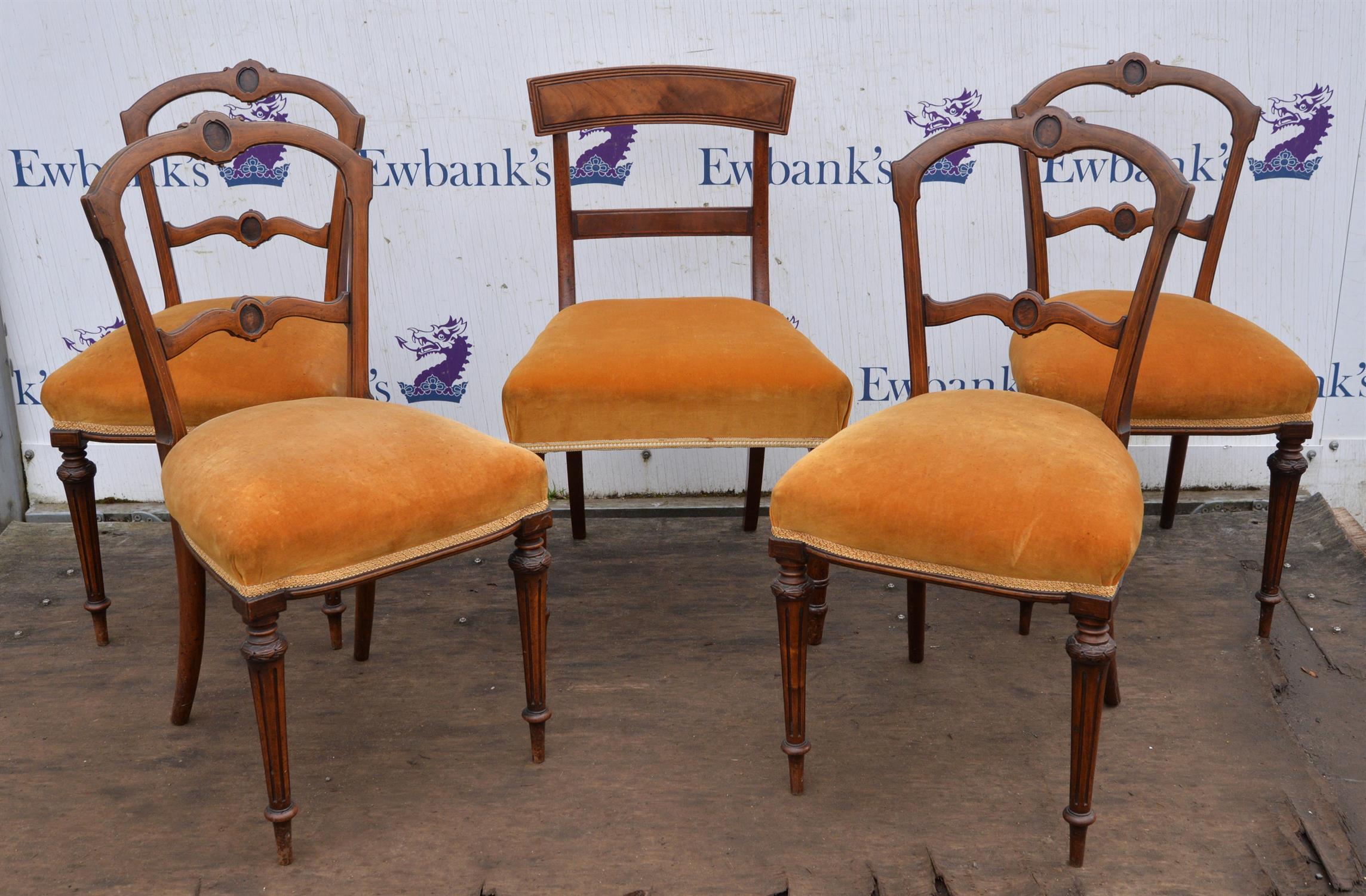 A set of four late Victorian rosewood salon chairs, inlaid with stringing, on fluted legs,
