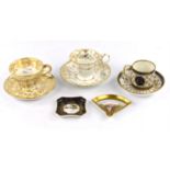 A late 18th/early 19th century Paris porcelain cabinet cup and saucer, gilt and foliate decorated