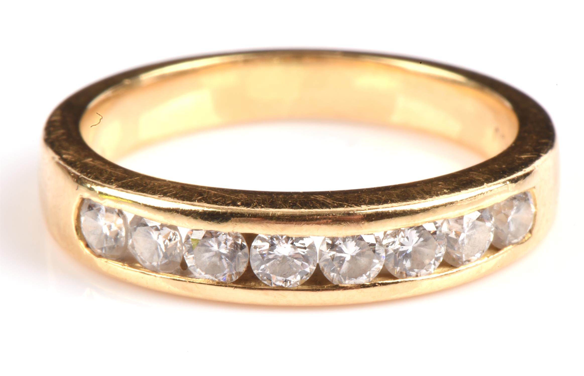 A diamond half eternity ring, eight round brilliant cut diamonds weighing an estimated total of 0.