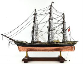 A small scale model of HMS Victory housed under a rectangular Perspex case, height 36cm and two