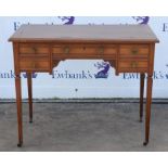 Edwardian desk, with faux leather writing surface, above five small drawers, on tapering legs,