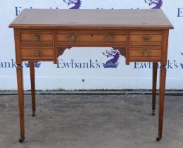 Edwardian desk, with faux leather writing surface, above five small drawers, on tapering legs,