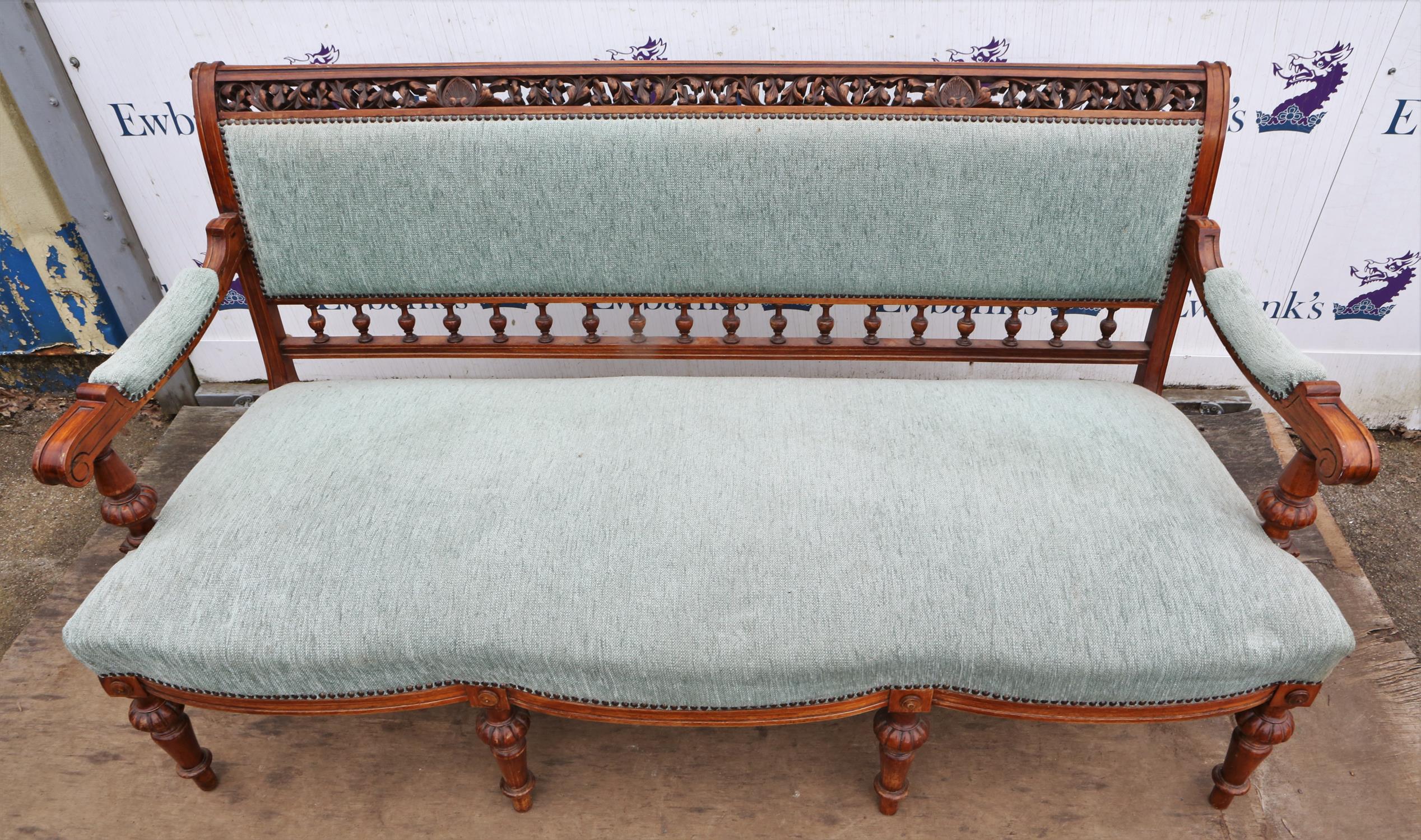 A late Victorian walnut and upholstered settee, the top rail pierced and leaf carved, - Image 2 of 6