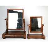 A William IV mahogany dressing table mirror, adjustable and on S-scroll supports,