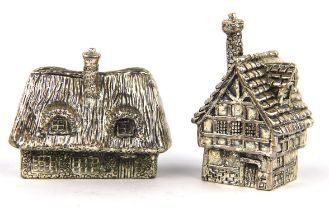 Two Rhodium silver plated model cottages. Impressed mark to base. Height 6cm. (2)