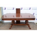 A Victorian style mahogany extending dining table, last quarter 20th century, the quarter veneered