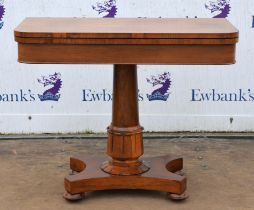 A William IV rosewood card table, the foldover top and lotus leaf carved column on bun feet with