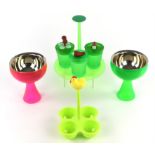 Stephano Giovannon for Alessi, three egg carriers, together with a collection of Alessi items to