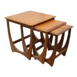 G-plan, a nest of three teak tables, 51cm high x 50cm square (3)