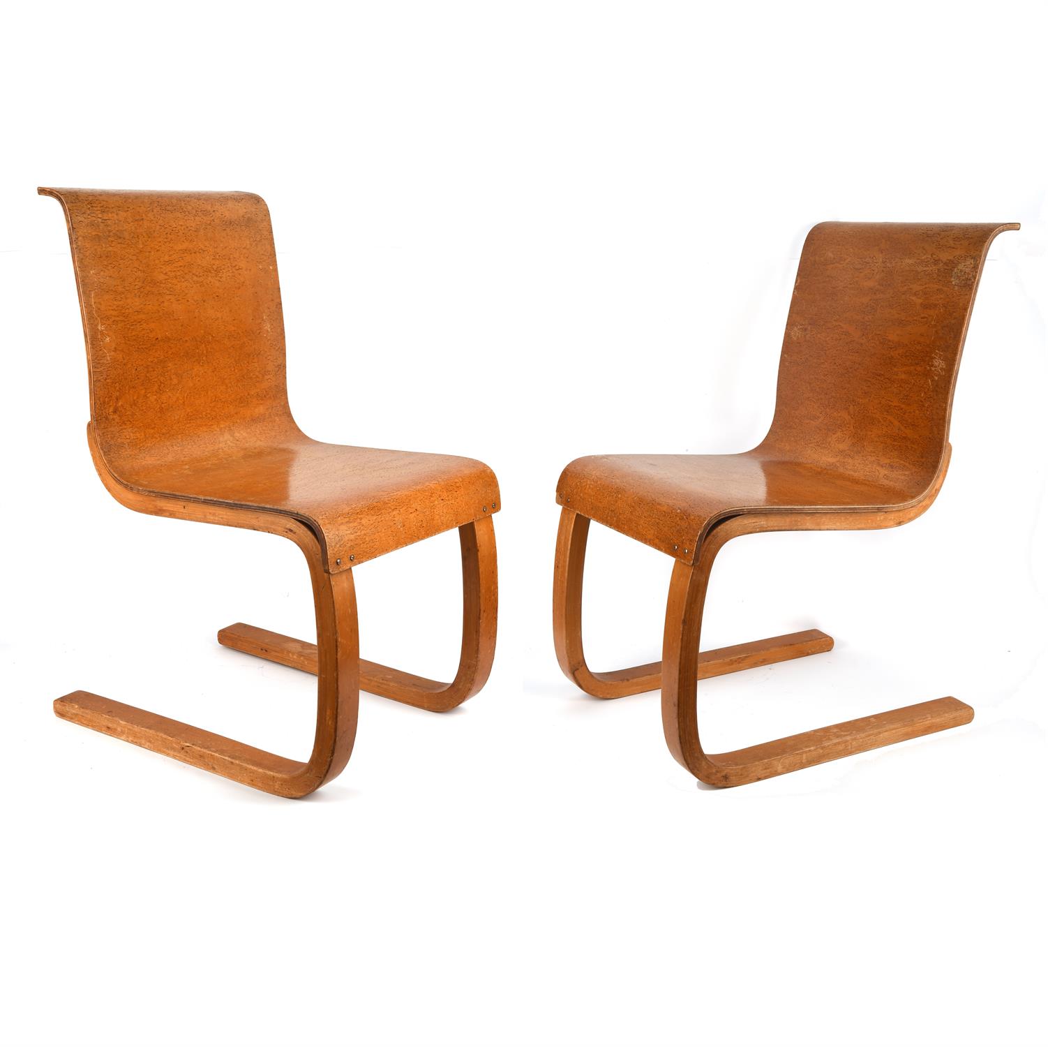 Alvar Aalto (Finnish, 1898-1976) for Finmar, pair of model 21 burr birch plywood chairs,