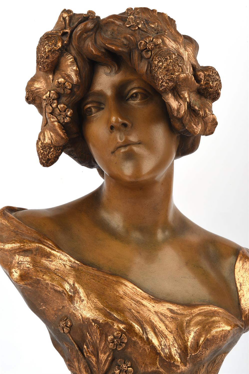An Art Nouveau Goldscheider painted and gilt decorated bust, rear with Goldscheider rectangular
